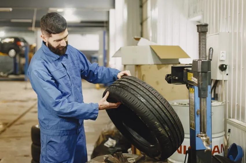 Mechanic examining a tyre